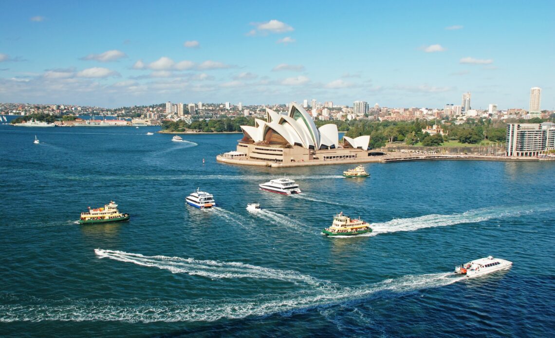 An aerial view of Sydney Opera House with ferries in front, Sydney, New South Wales, Australia