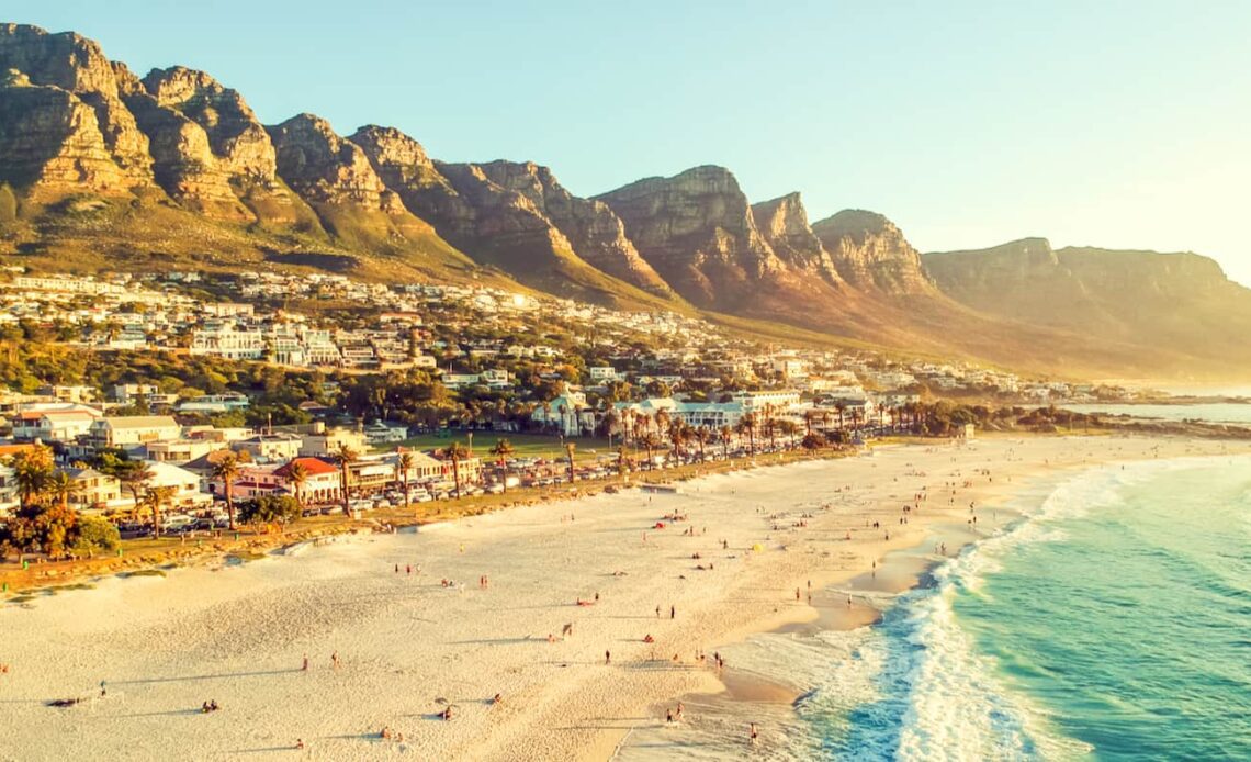 A view overlooking the beautiful beach of Cape Town, South Africa with mountains in the distance