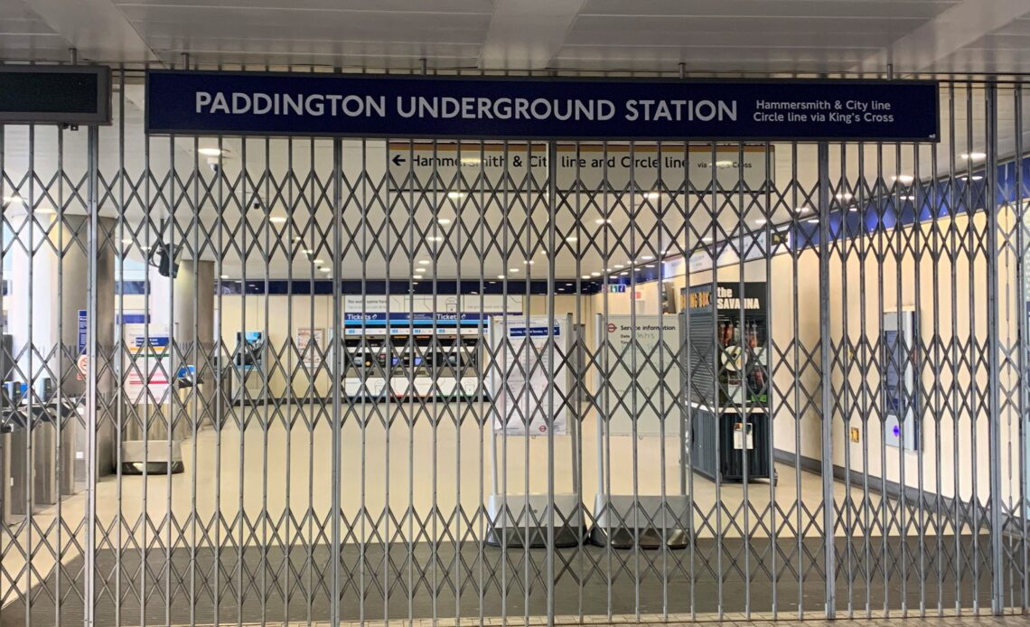 <p>Closed gates at London’s Paddington underground station, as strike action closes the entire TfL network</p>