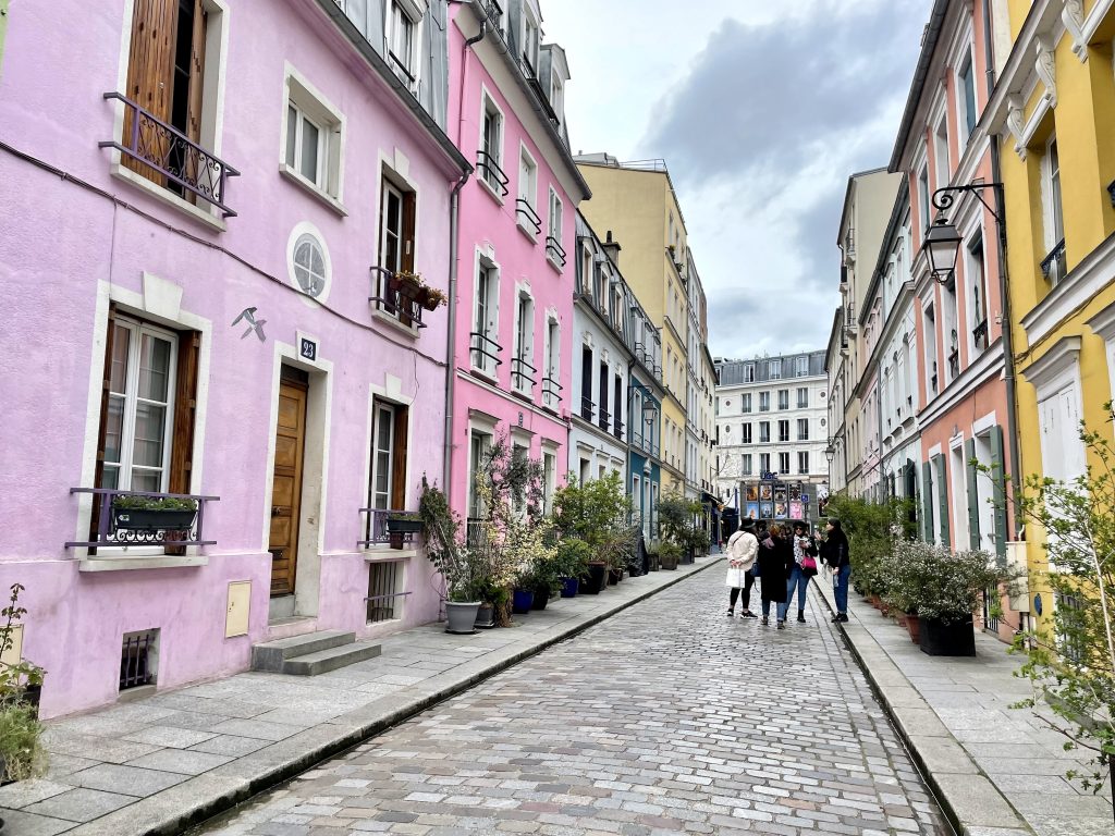 Rue Cremieux, a small Paris street with brightly pastel-colored buildings.
