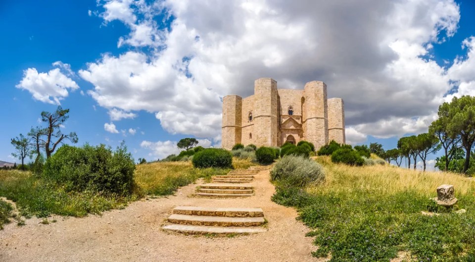 Beautiful view of Castel del Monte, the famous castle built in an octagonal shape by the Holy Roman Emperor Frederick II in the 13th century in Apulia, southeast Italy