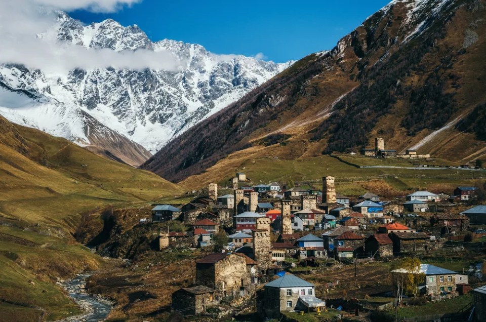 Svanetian Towers in Ushguli in autumn. One of the highest inhabited village in Europe. Caucasus, Upper Svaneti, Georgia.. UNESCO World Heritage Site.