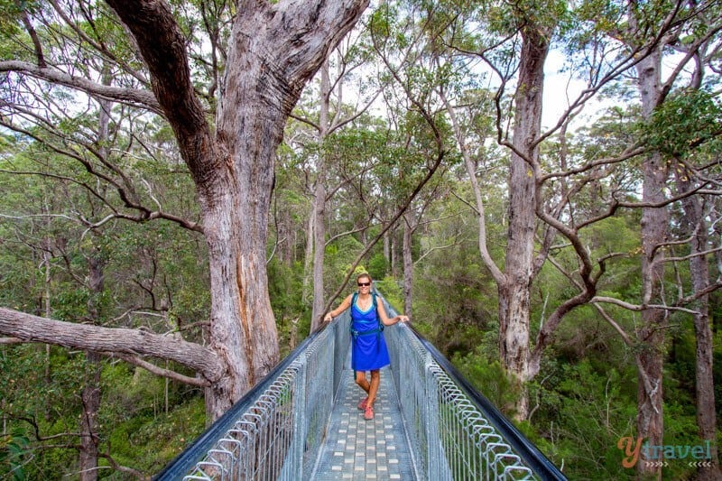 woman standing on a bridge