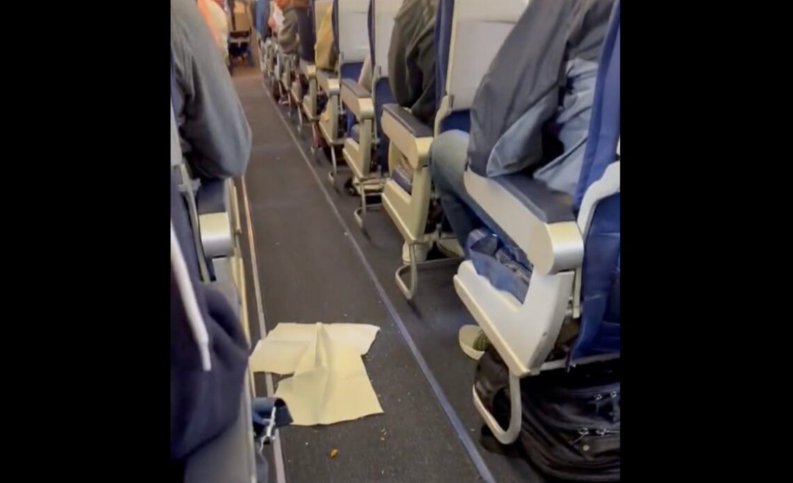 Flight attendant won’t let plane leave until passengers clean up mess dropped in the aisle