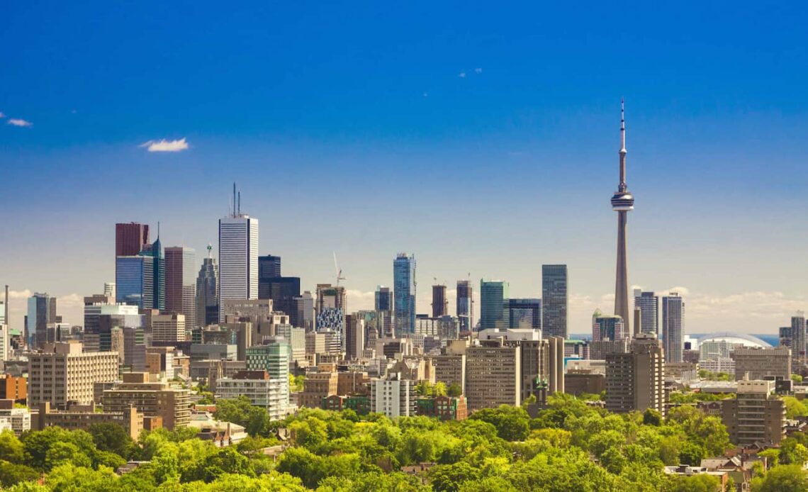 The towering skyline of Toronto, Canada on a bright and sunny summer day