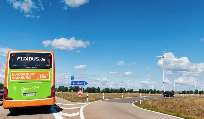 A FlixBus bus on a highway in Europe during the summer