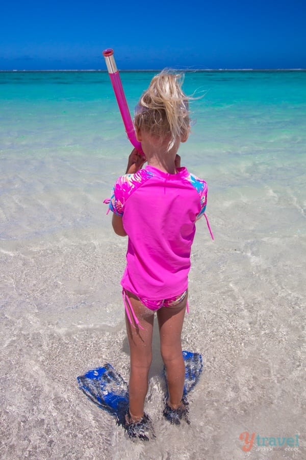 Kalyra with snorkels on about to walk into Turquoise Bay