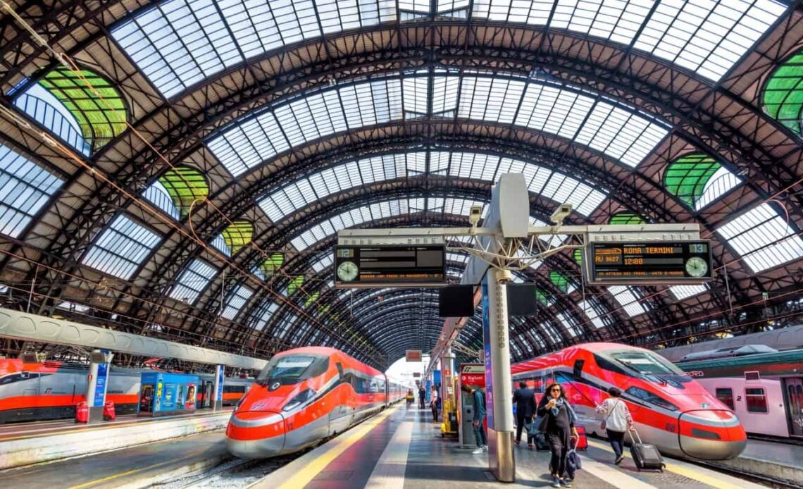 High speed trains waiting for departure on platforms at the train station in Milan, Italy