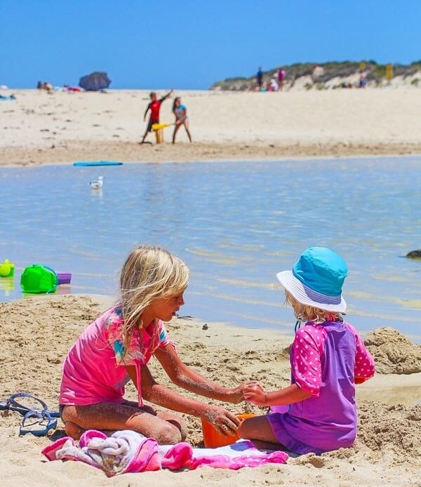 kalyra and savannab playing on the beach at Margaret River, Western Australia