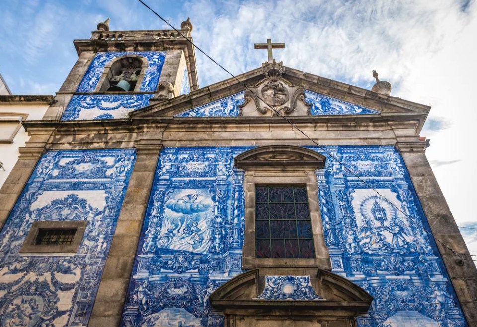 Characteristic tilework called Azulejo on Capela das Almas church in Porto, Portugal