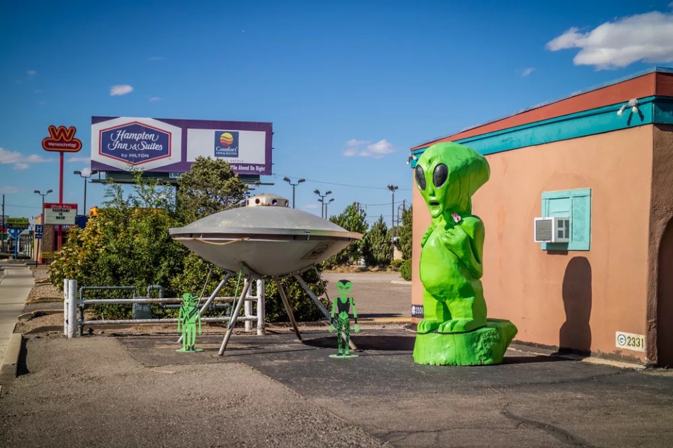 A life size green UFO model just outside the town