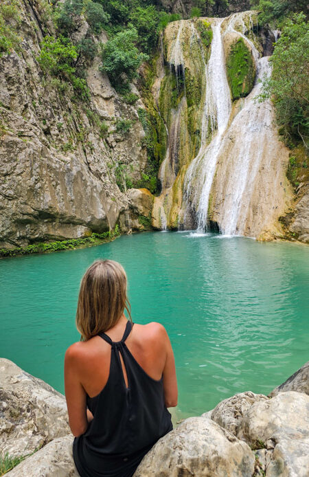 caz looking at Polylimnio Waterfall