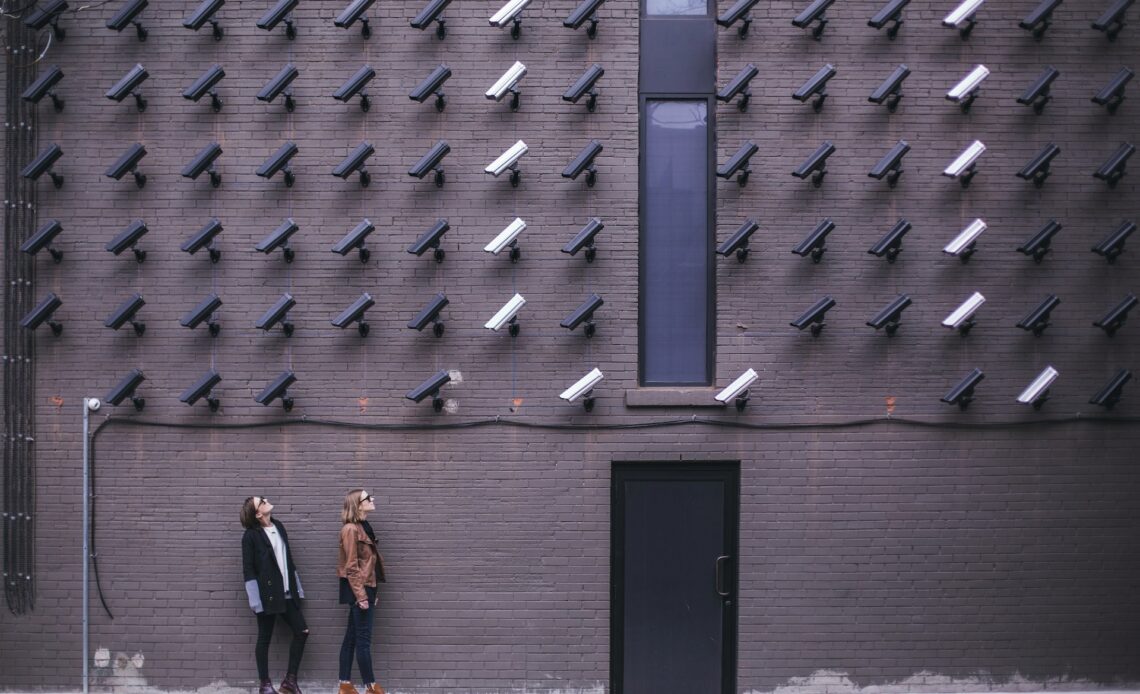 Women look at security cameras, a commentary on privacy concerns in the modern era. (photo: Matthew Henry)