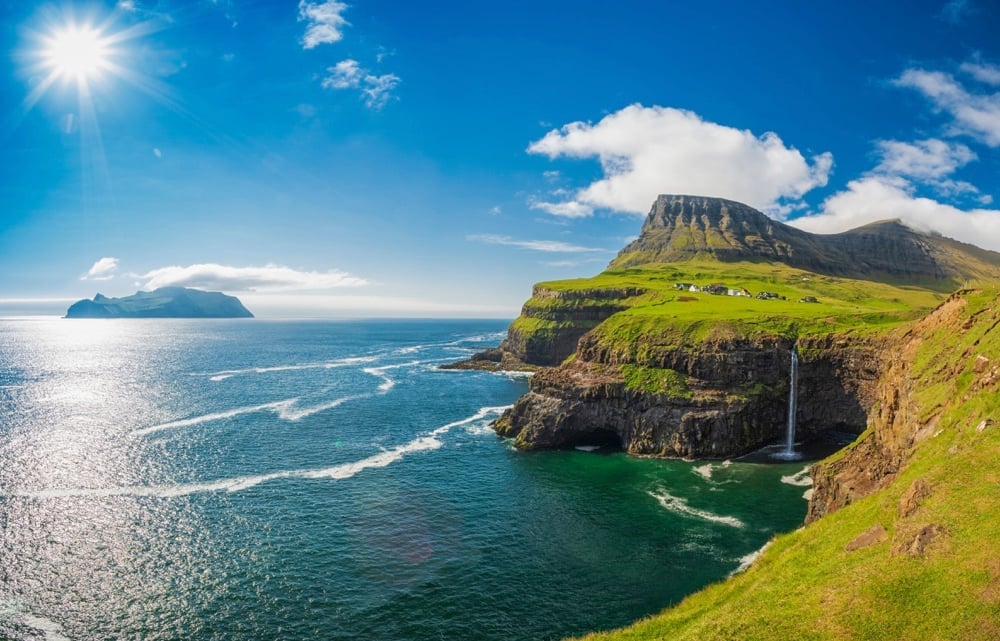 Beautiful Denmark scenery of cliffs, sea and a waterfall 