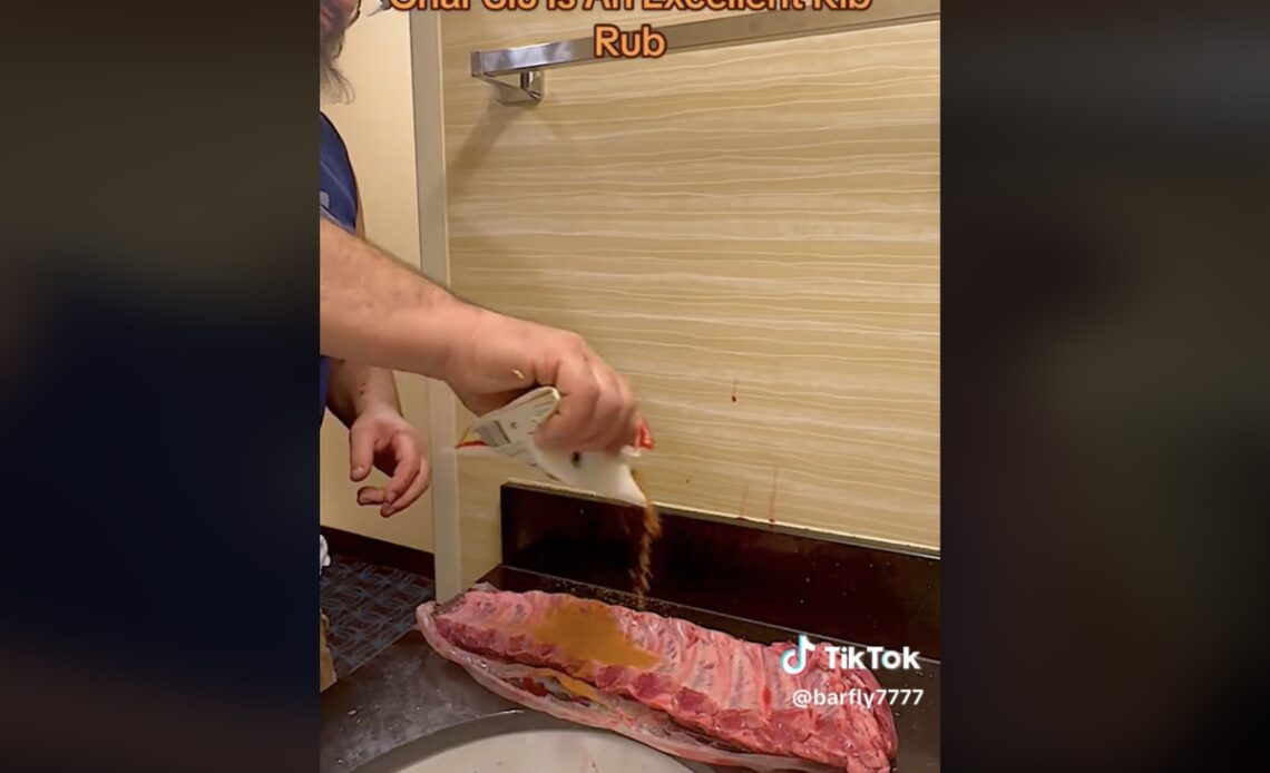 Man cooks baby back ribs in a hotel bathroom