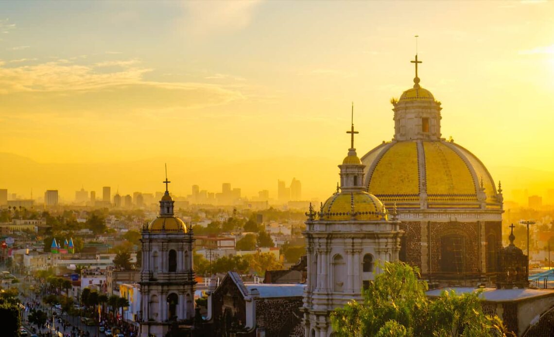 A golden sky over the sprawling downtown Mexico City skyline in Mexico