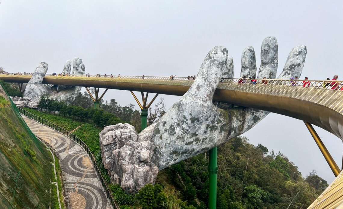 Visitors walk across the Golden Bridge in Central Vietnam.