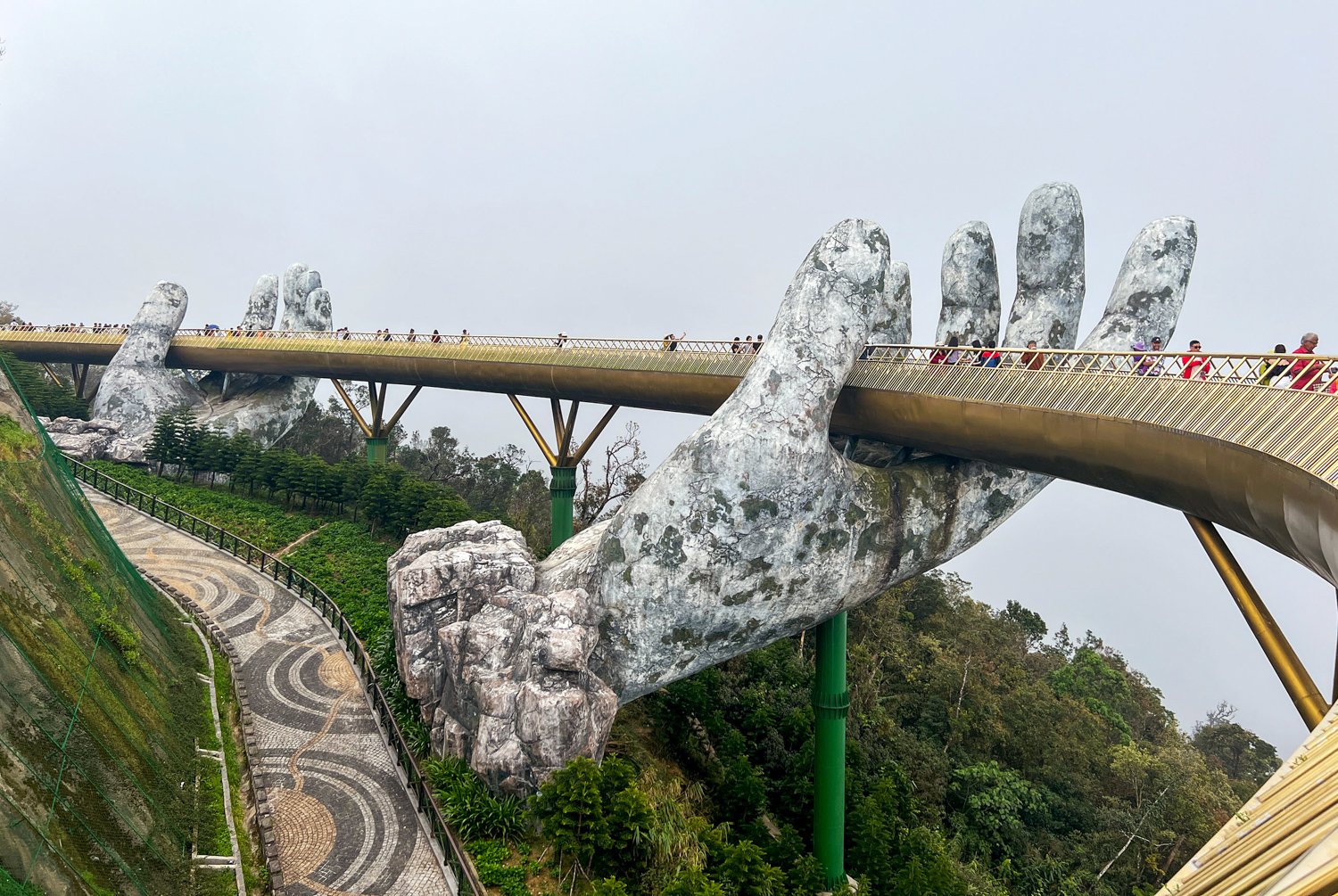 Visitors walk across the Golden Bridge in Central Vietnam.