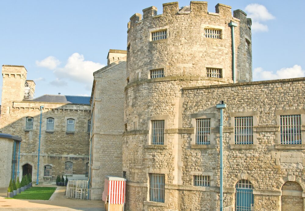 The close-up of Oxford Castle in England, now transformed into a hotel and tourist spot, showcases its grandeur.