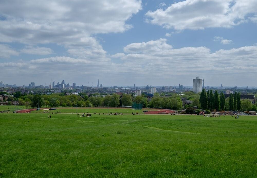 Green and clean park of Hampstead Heath in London during the morning.