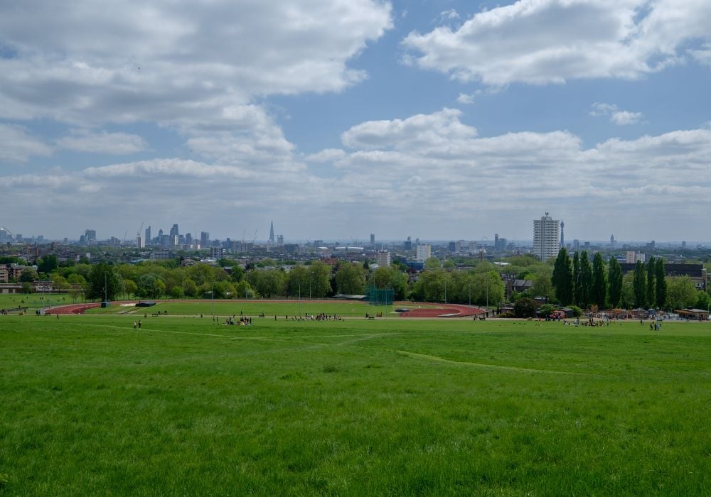 Green and clean park of Hampstead Heath in London during the morning.