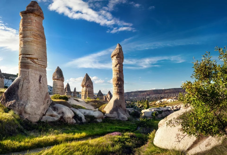 Ancient geological formation called fairy chimneys at sunset in Cappadocia, Turkey