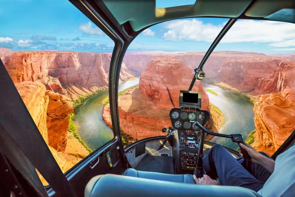 Helicopter cockpit scenic flight over Horseshoe Bend of Colorado River in Arizona, United States. Downstream from the Glen Canyon Dam and Lake Powell.