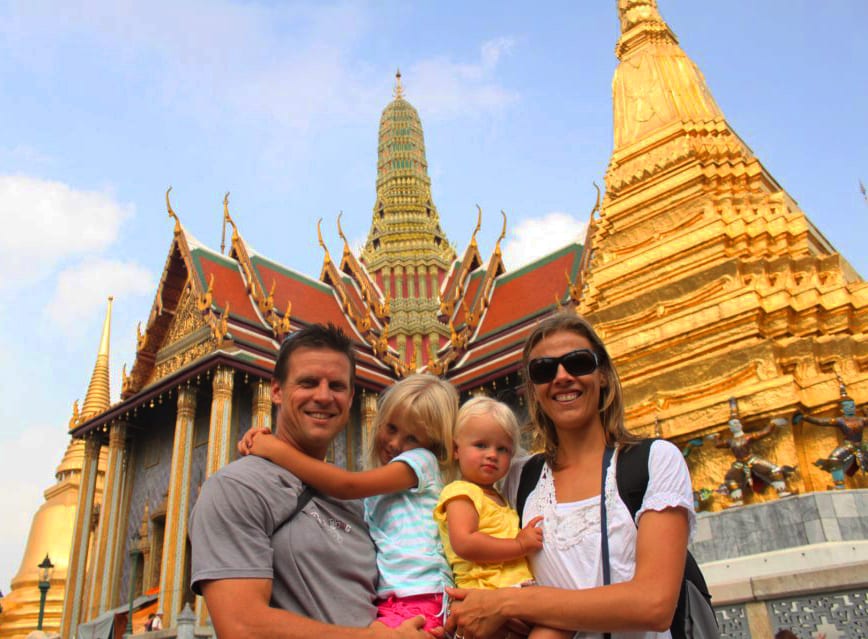 people standing in front of a temple