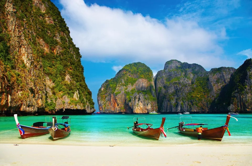 Tropical beach, traditional long tail boats, famous Maya Bay, Thailand