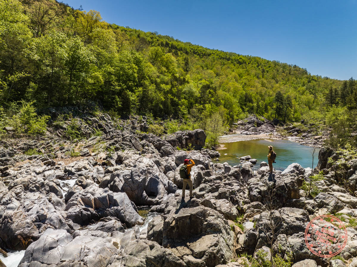 couple standing on rocks at johnson's shut-ins state park in 6 day ozarks of missouri itinerary