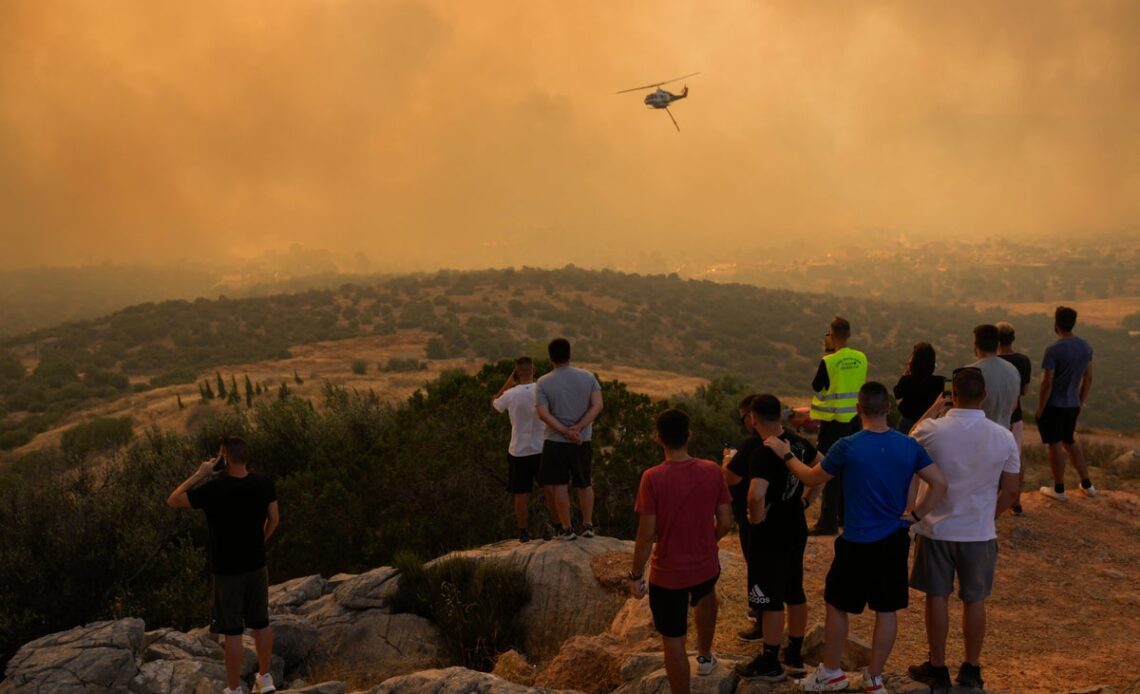 Families unable to cancel summer holidays to Spain and Greece despite extreme heat warnings and wildfires