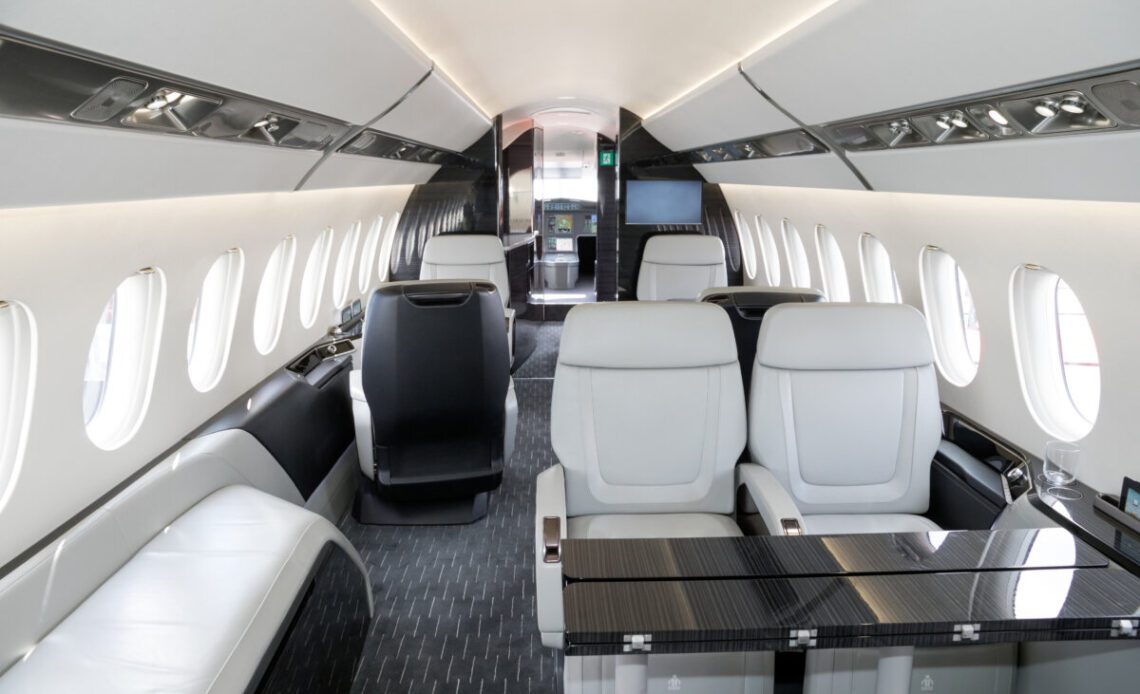 Modern business jet aircraft interior cabin view.