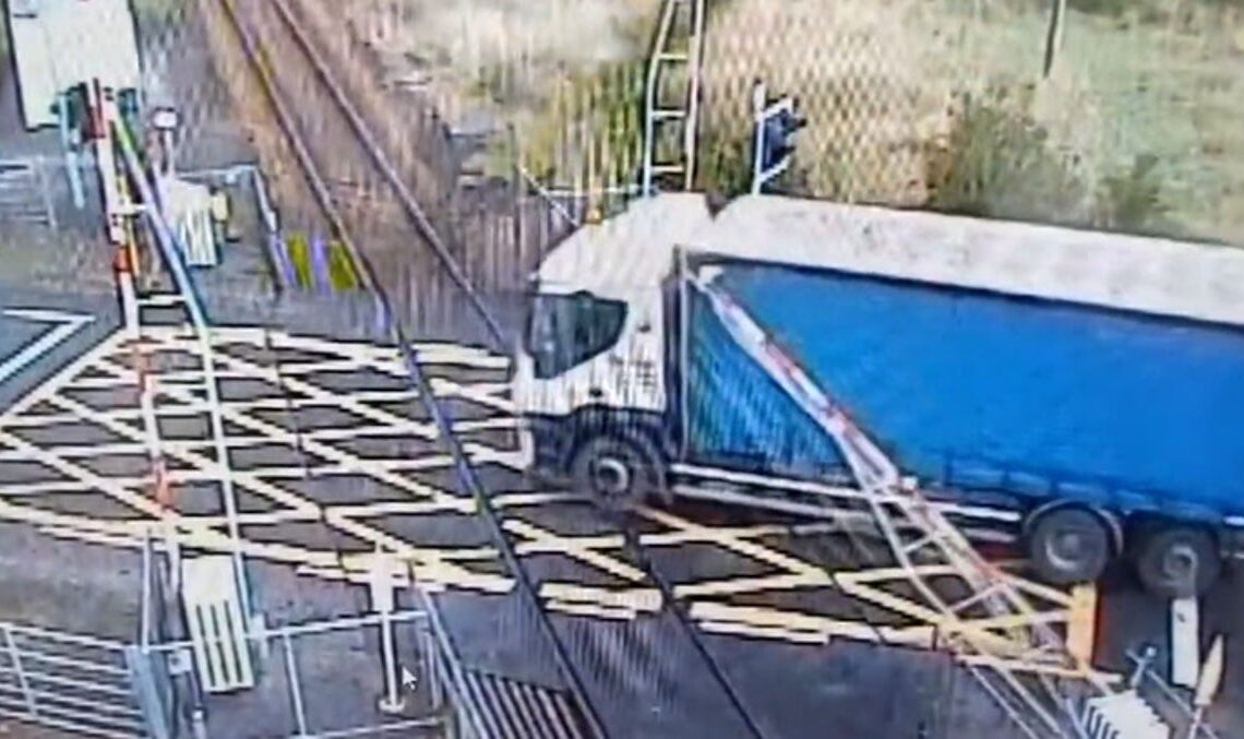 Moment lorry drives through descending railway barrier | News