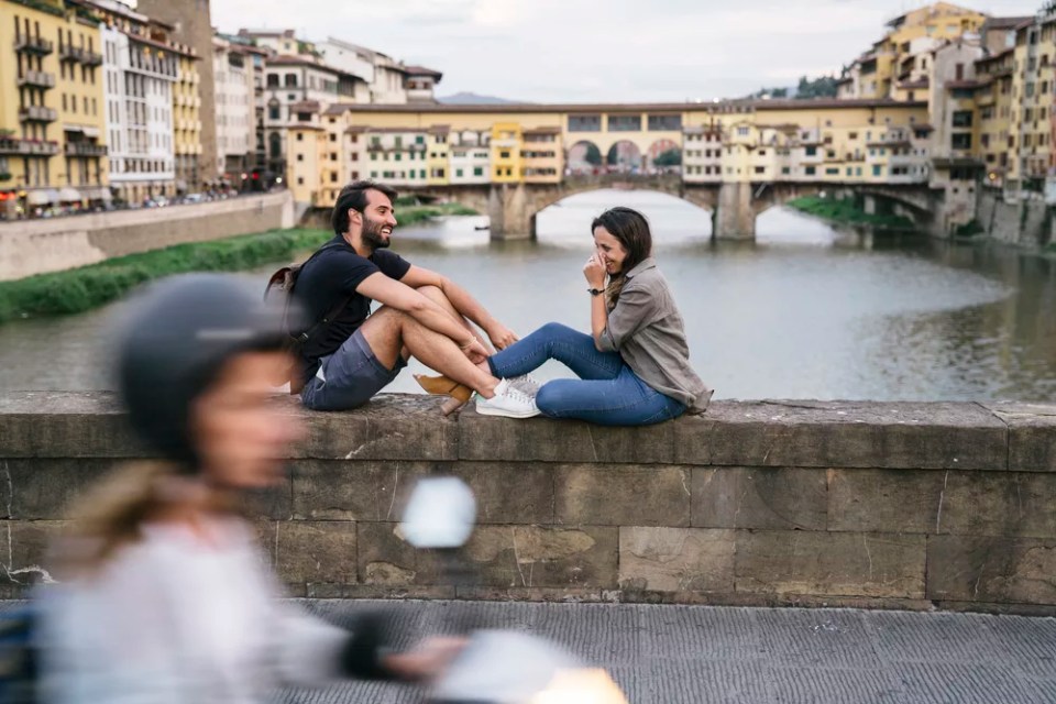 Couple in front of Ponte Vecchio in Florence