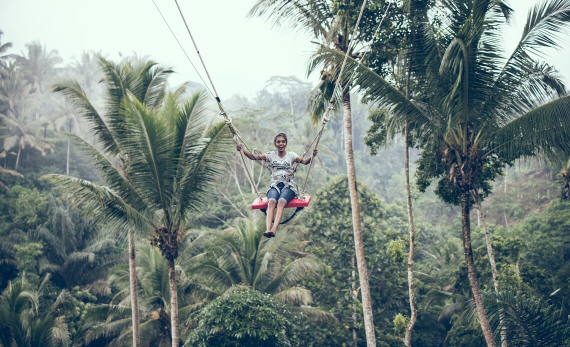 A woman swinging in Bali (photo: Artem Beliaikin)