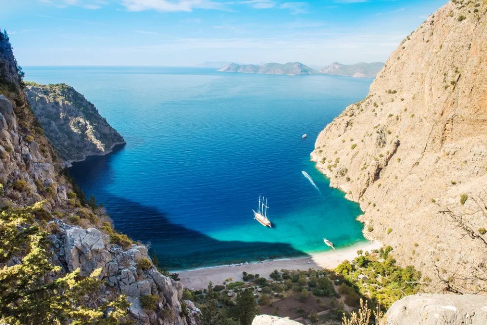 Summer butterfly valley sea beach view and cruise boat Oludeniz,Turkey