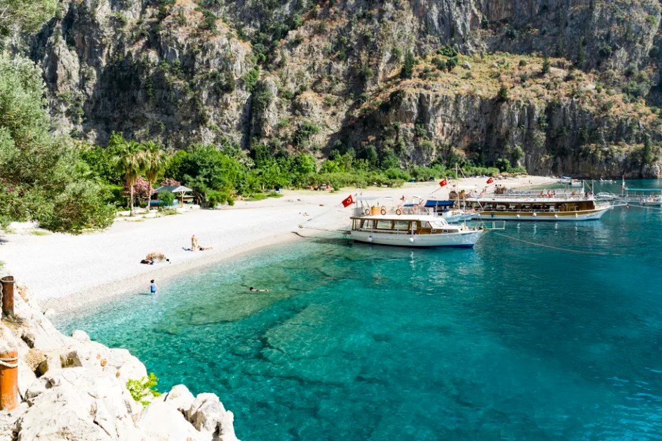 BUTTERFLY VALLEY BEACH, TURKEY - JUNE 01: Tourists visit famous Butterfly Valley beach near Oludeniz in Turkey on JUNE 01, 2016. Butterfly Valley  beach is one of the best beaches in Turkey