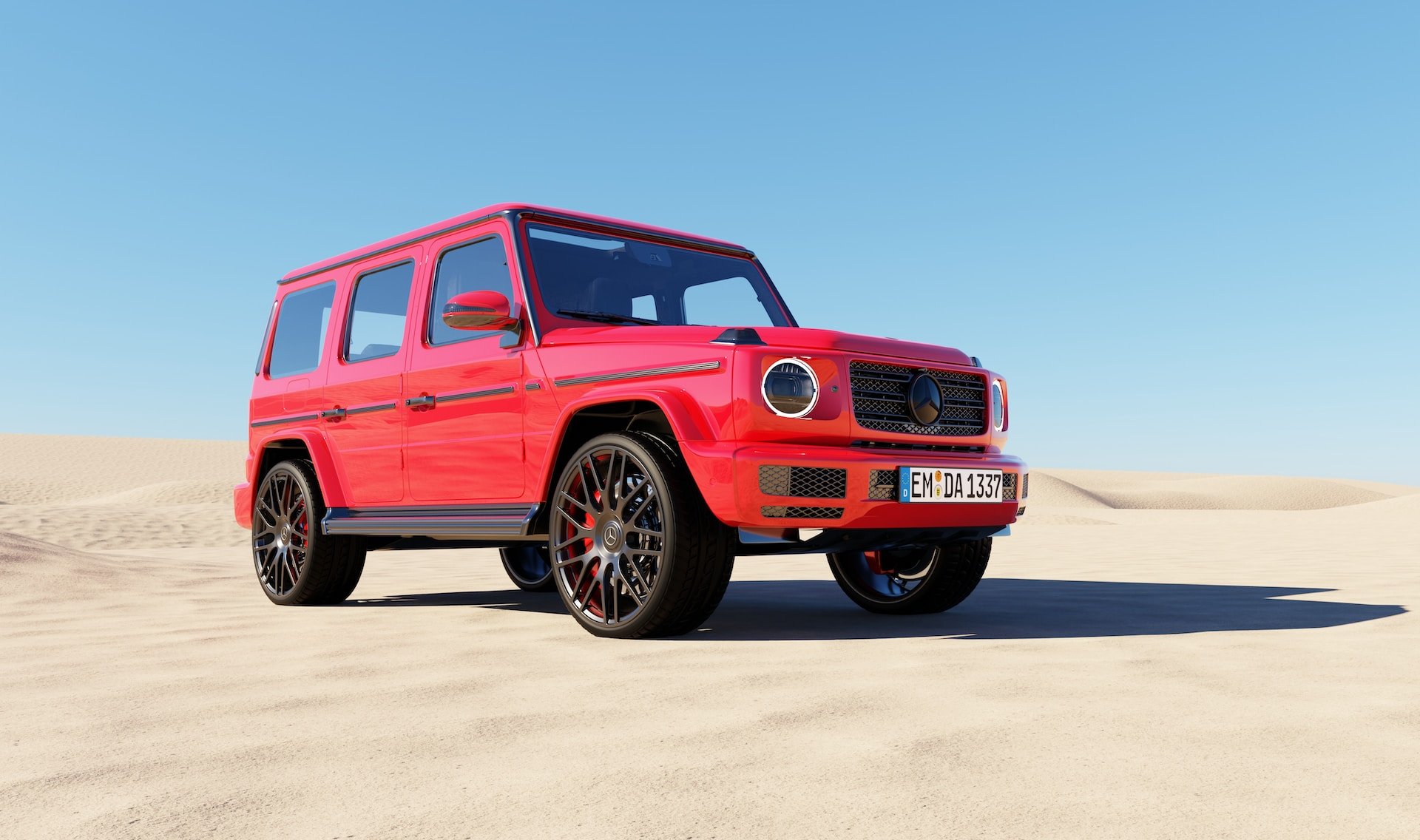 Red Mercedes G Wagon with black rims in the dunes of Dubai (photo: Dan)