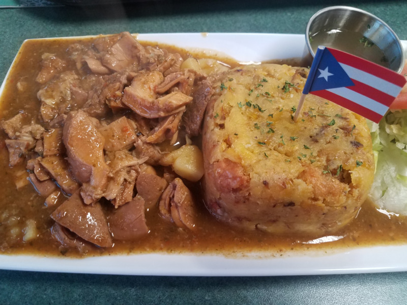 Mofongo meal with Puerto Rico flag on plate