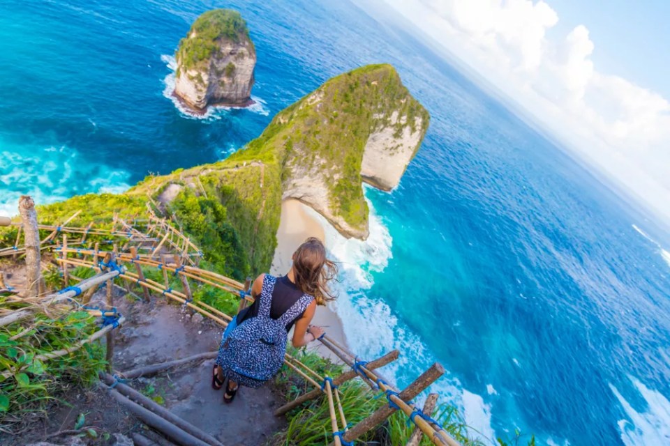 Young Woman Standing and Watching Beautiful View on Nusa Penida Island in Bali, Indonesia