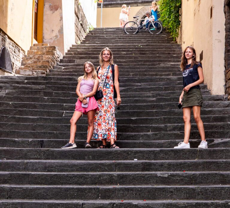 caz and girls posing on stairs in oltrarno florence