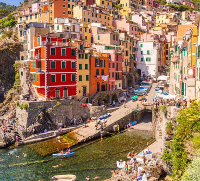looking at harbor and colorful buildings of Riomaggiore