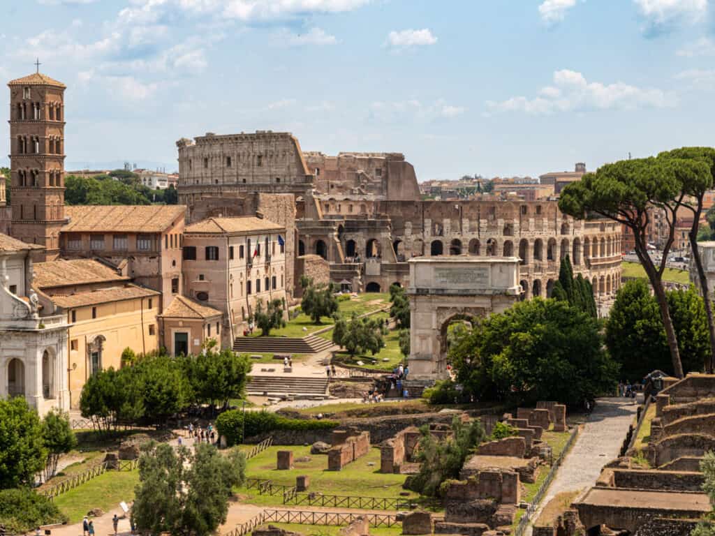 aeiral view of roman forum and colosseum in the background