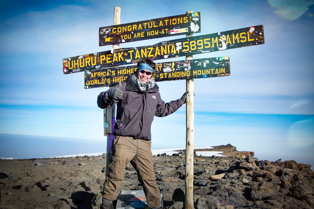 Peter the summit of Kilimanjaro in bright sunshine