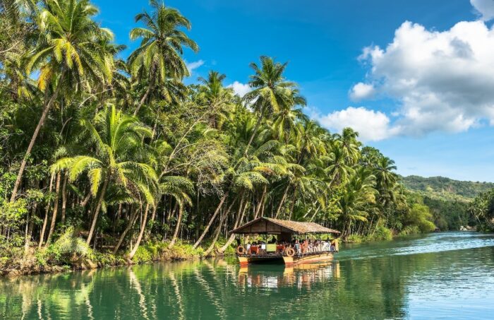 Experience cruising along Loboc River onboard a floating restaurant.