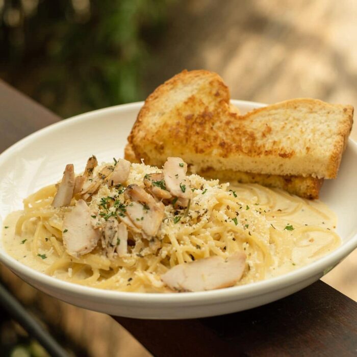 Get a taste of Cafe Agapita's creamy and savory Chicken Alfredo.