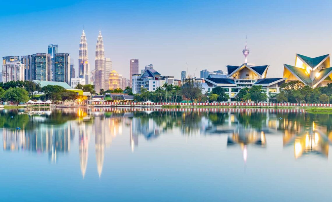 The view overlooking stunning Kuala Lumpur, Malaysia as seen from a nearby park with a lake