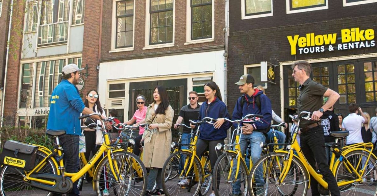 Tourists on an Amsterdam City Highlights Bike Tour