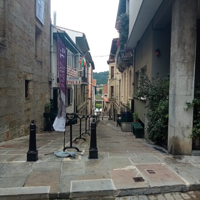 Cobblestone set within narrow alleys and Medieval structures