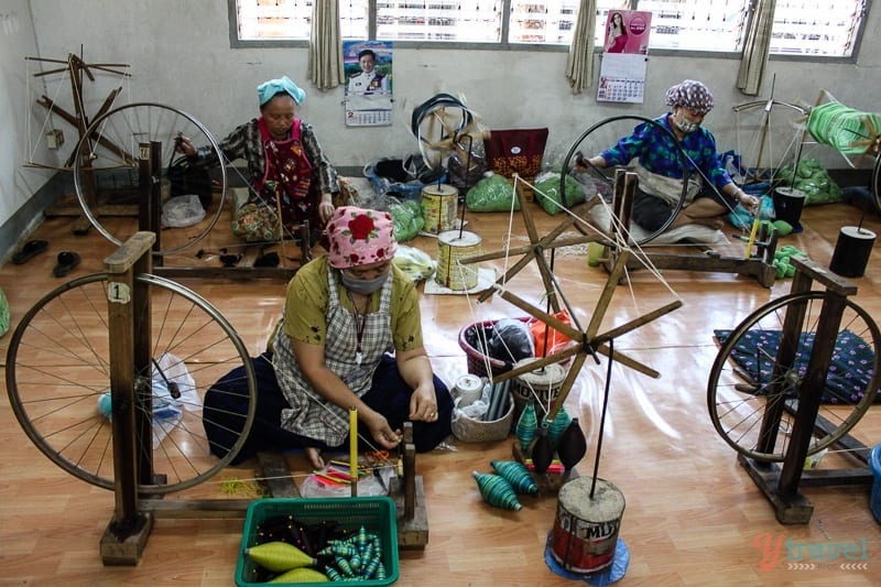 women sitting on floor sewing of doi Tung Royal Project Chiang Rai Thailand